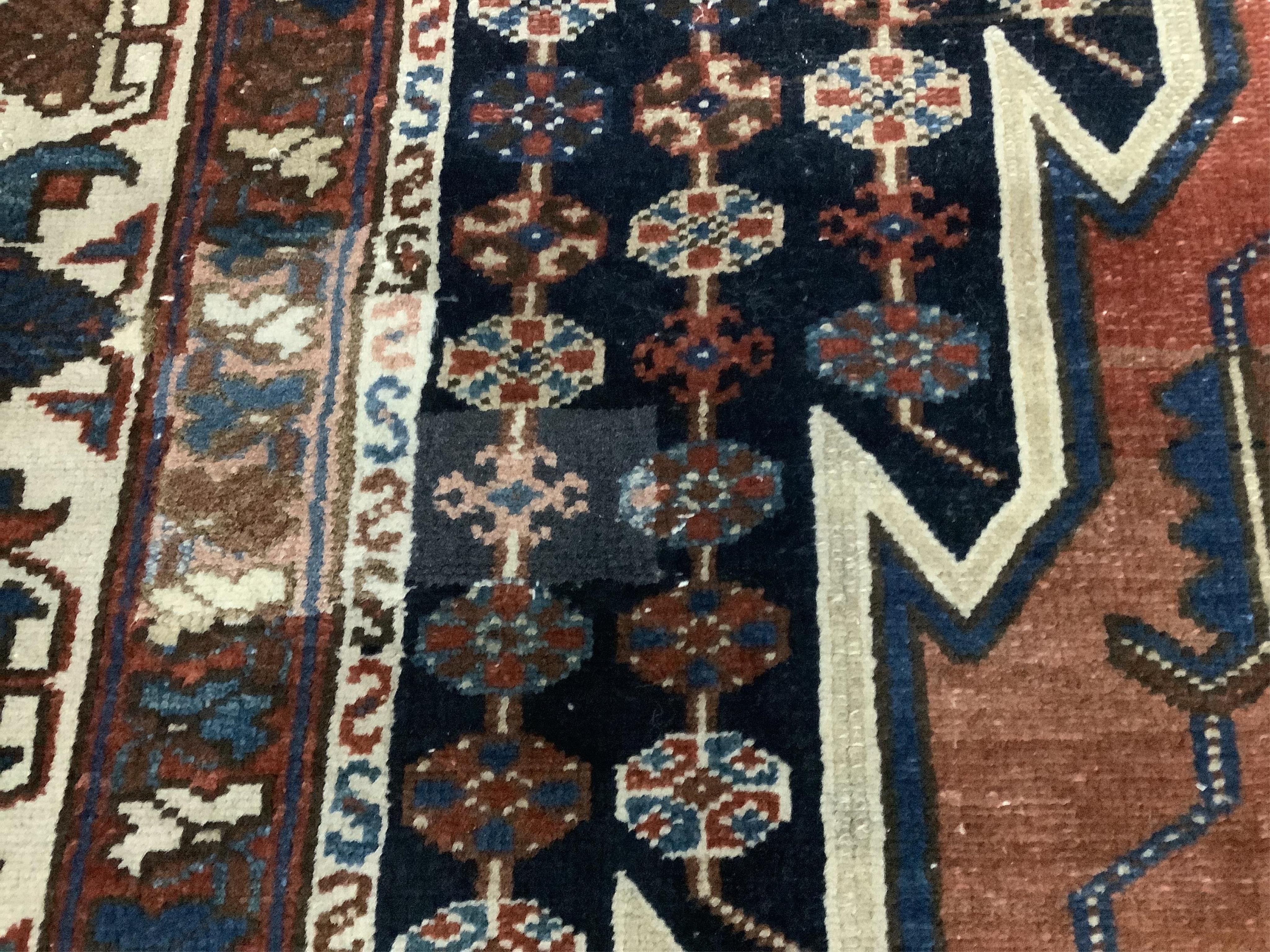 A Mazleghan blue ground rug, 194 x 136cm. Condition - fair but has a patch repair